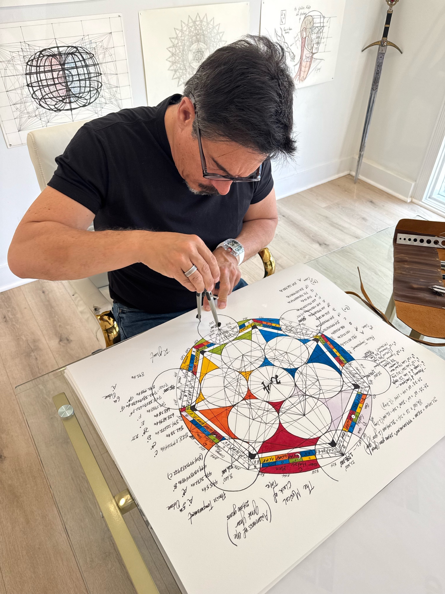 Overhead view of Robert Edward Grant drafting geometric composition